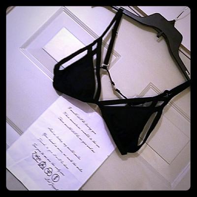 Strappy black swim top. Nwt