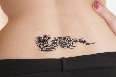 1083 – Dragon Lower Back Gem Tattoo